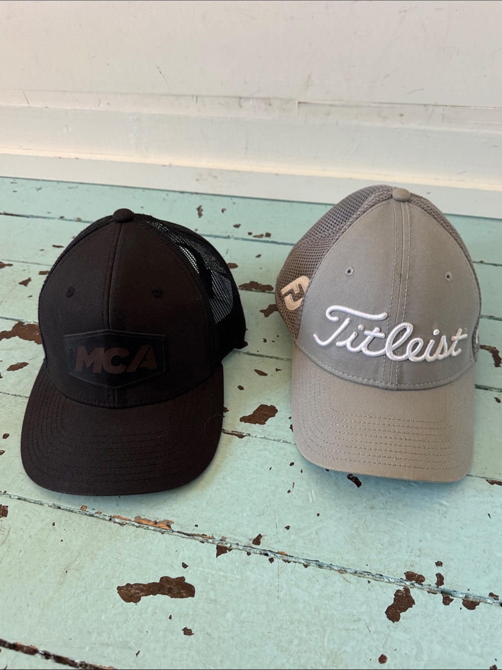 Titlest FootJoy Pro V1 Mesh Golf Cap (Med-Large)  and an MCA All Black  Cap.